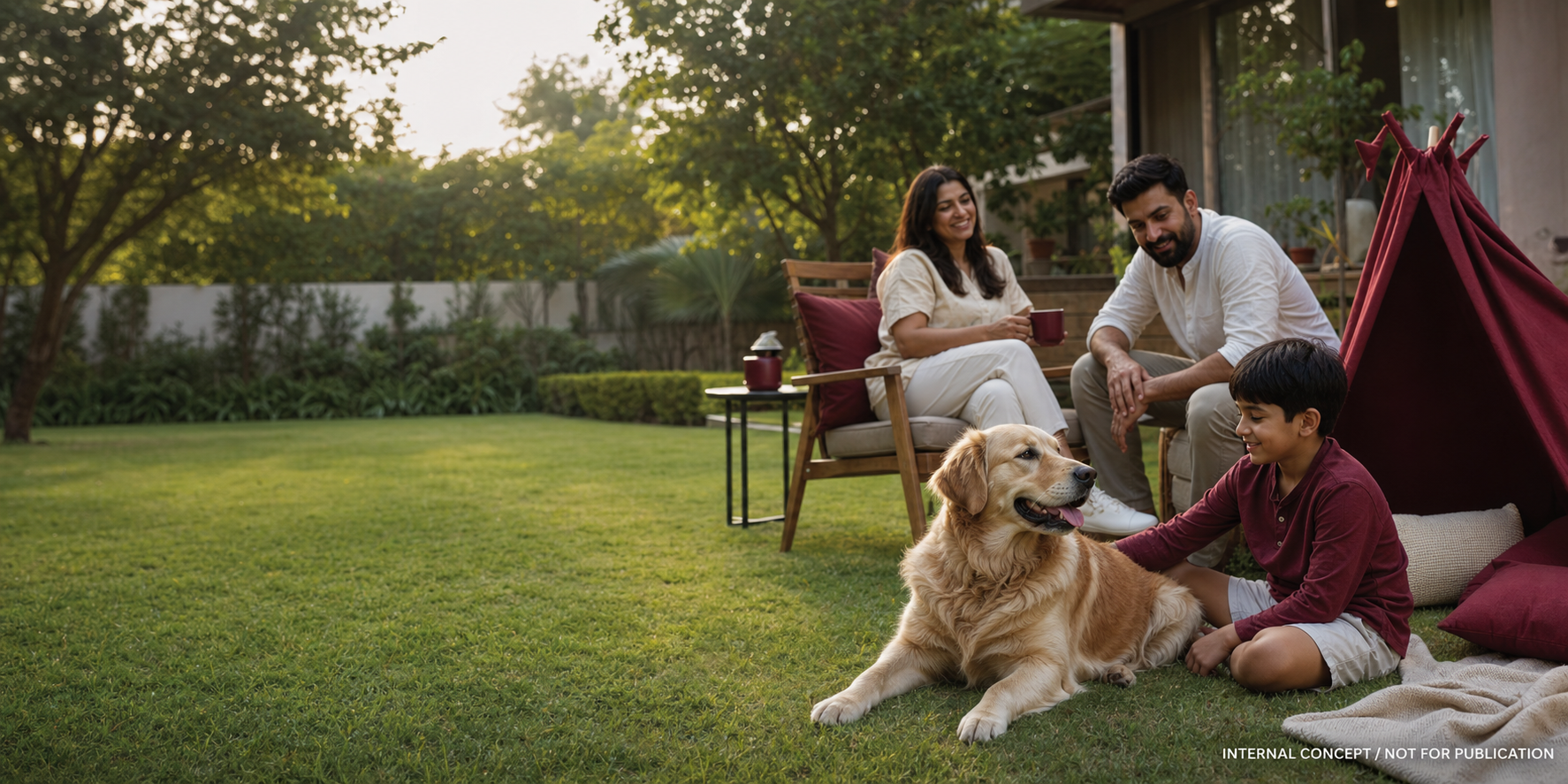 A dog and family relaxing together in a backyard.